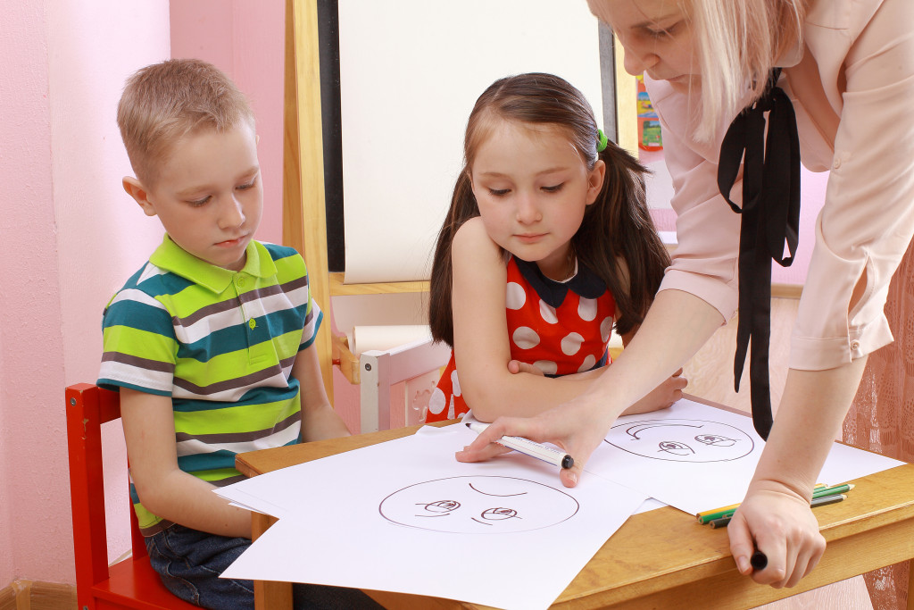 Children learning from teacher
