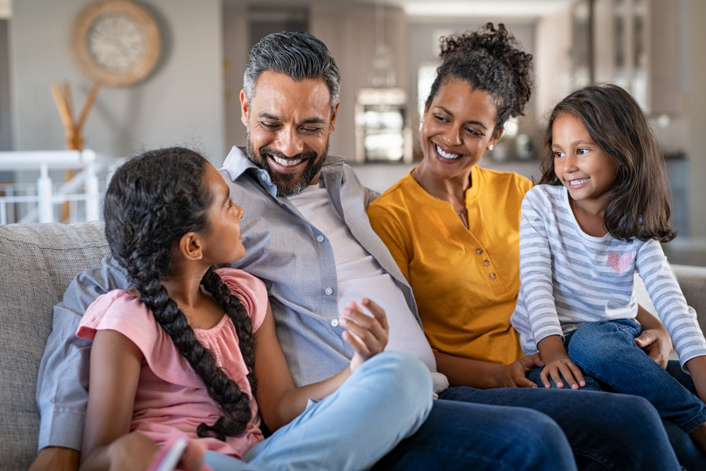 family talking in the living room couch